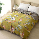 Decorative boho-style patchwork throw with floral and bird motifs