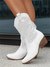 Ankle cowboy boots with cutouts, stable heel, and side zipper