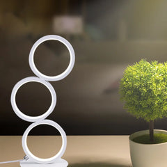Decorative round stack LED desk lamp with warm ambient lighting