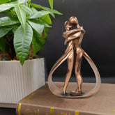 Decorative abstract sculpture depicting a couple embracing