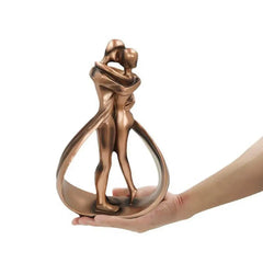 Decorative abstract sculpture depicting a couple embracing